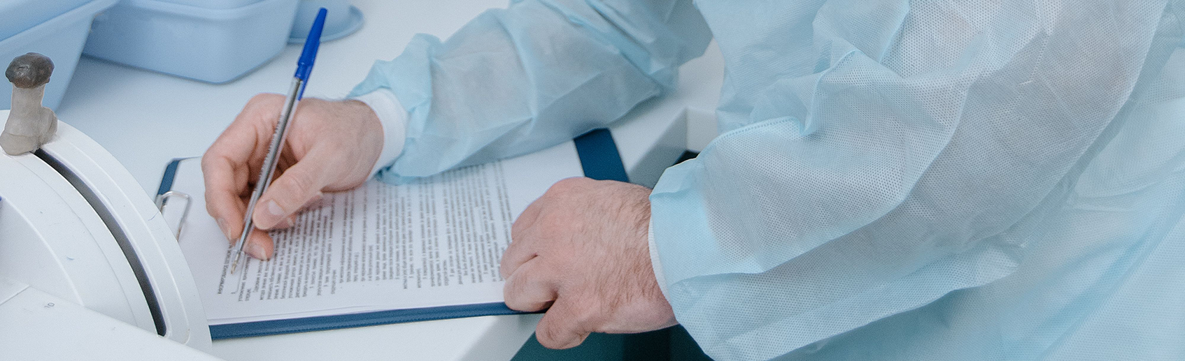 Patient filling medical form at doctor visit